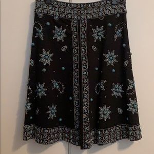 Black skirt with silver and turquoise stones.